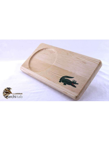We embellished Lacoste's crocodile with a little humor and made a wooden plate.