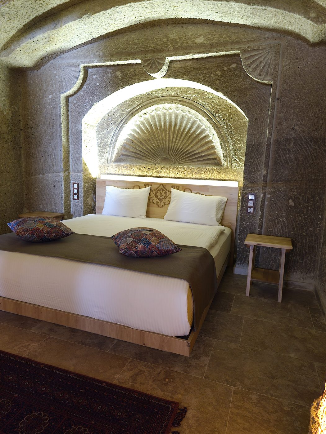 Solid pine furniture: wooden valet stand in a Cappadocia cave hotel loft corridor